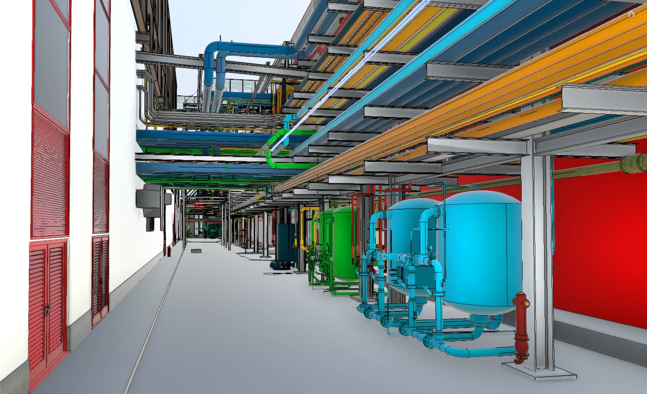 Interior del modelo BIM de la planta: galería de tuberías por colores y depósitos de proceso